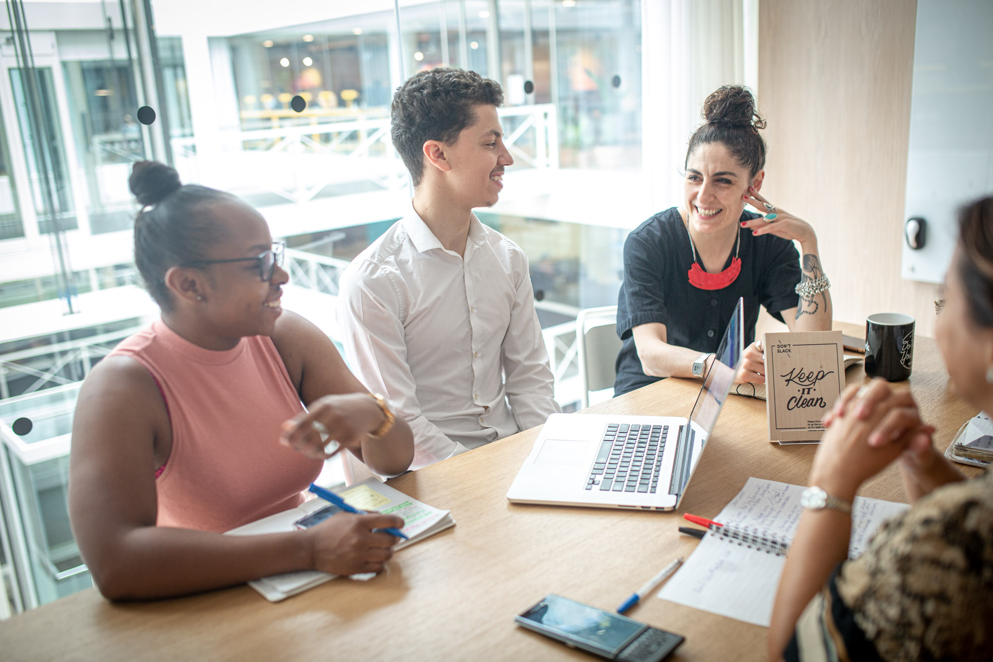 Young person chats with colleagues